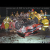 photograph of overturned sports car.