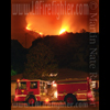 forestry engine at base of fire