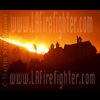 photograph of houses in a brush fire