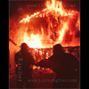 photograph of firefighters in front of house