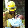 photograph of firefighter with baby